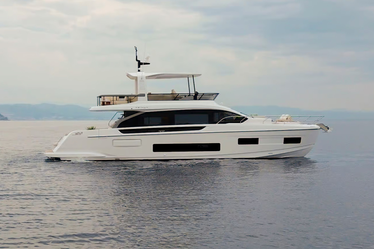 A motor yacht at rest in calm water at the end of the day