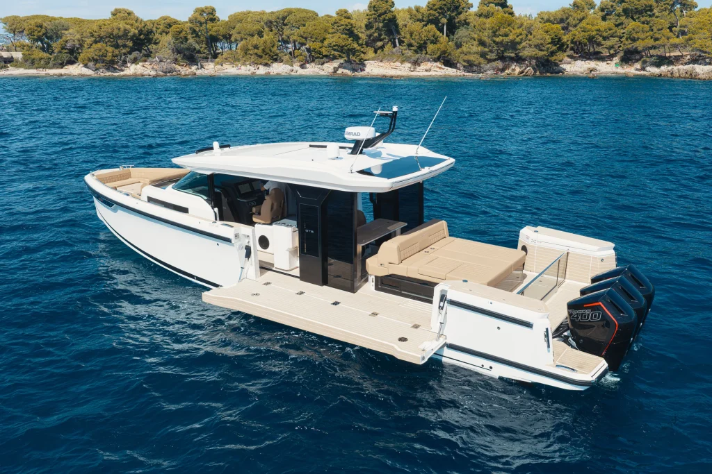 Saxdor 460 GTS at anchor off a wooded coast